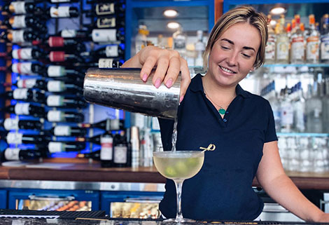 Bartender pour a martini