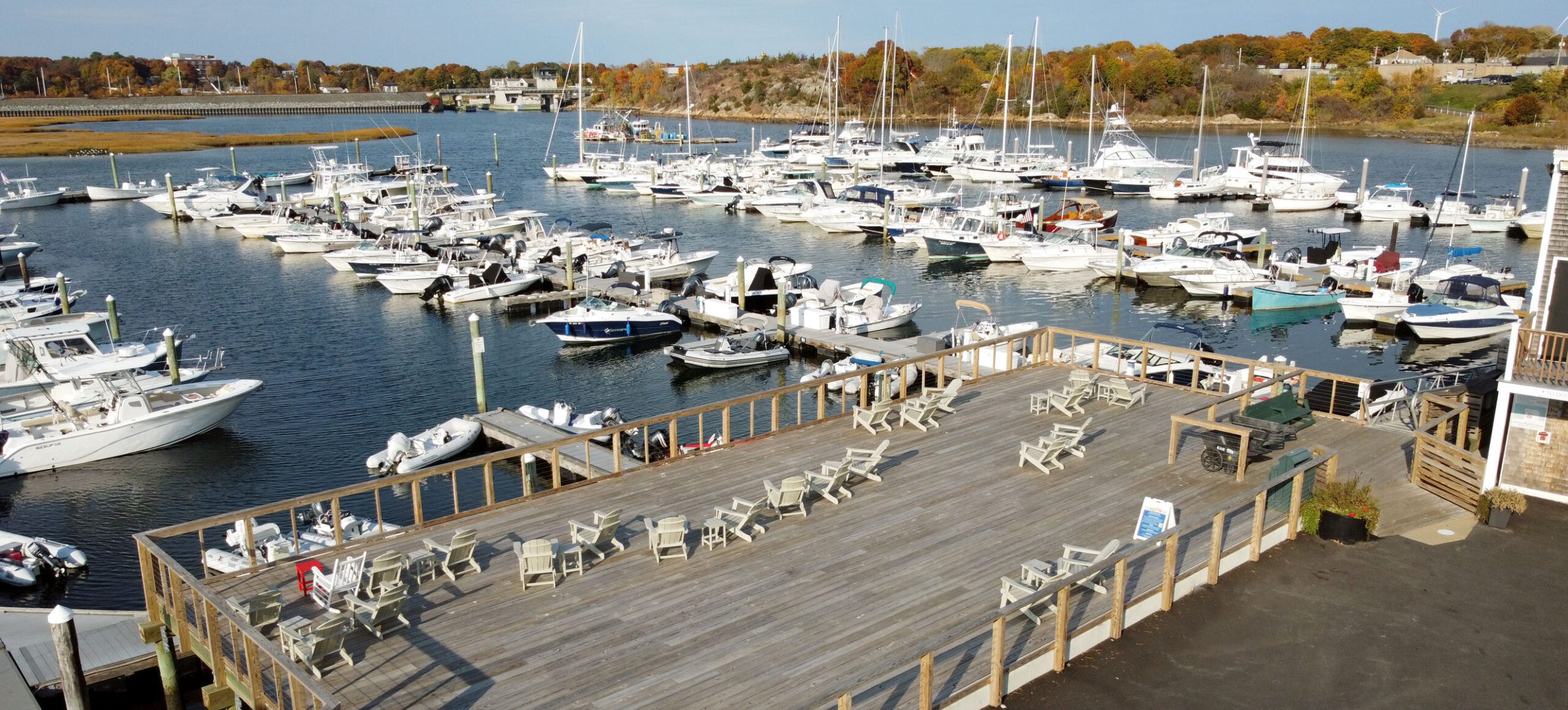 aerial of marina, deck and riverfront