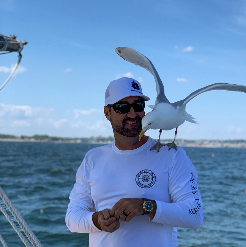man with seagull bird on shoulder
