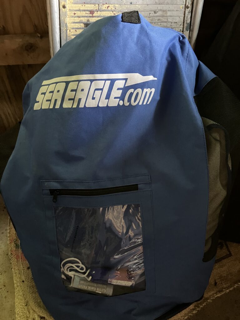 blue bag with boat inside