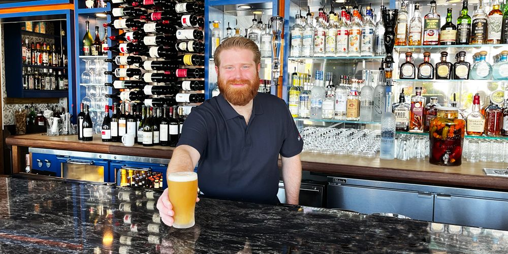 Bartender serving beer at Mile Marker One