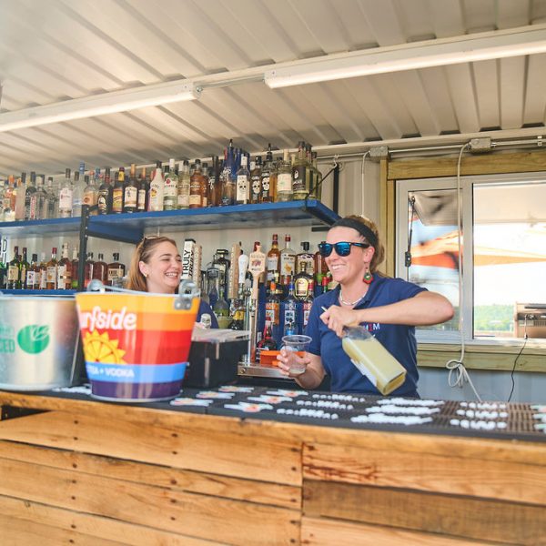 Girls making cocktails in a Container Bar