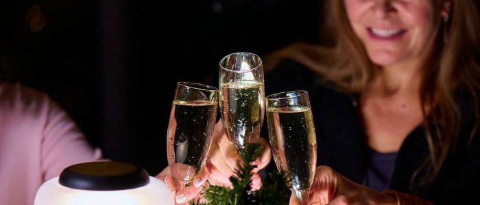three champagen glass toast dark background