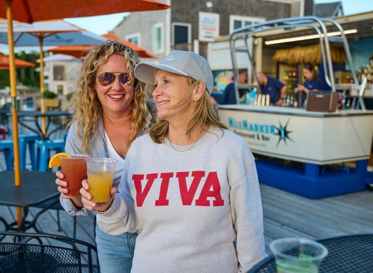 two ladies holding cocktails