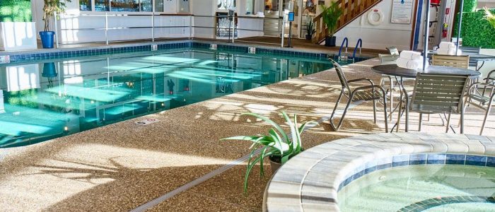 indoor pool and jacuzzi with sunlight