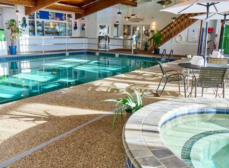 indoor pool and jacuzzi with sunlight