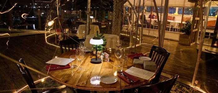 Low light table setting in clear dome