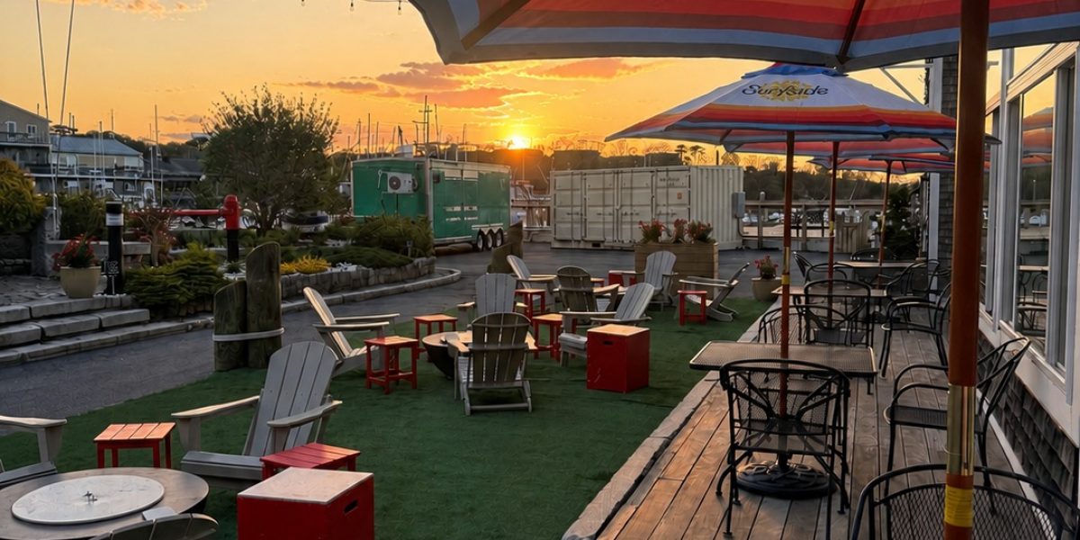 Sunset tables chairs umbrellas courtyard at Cape Ann Marina