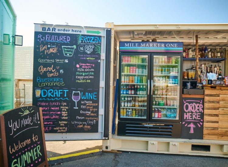 Container Bar. Cooler with beer and berages with drink menu