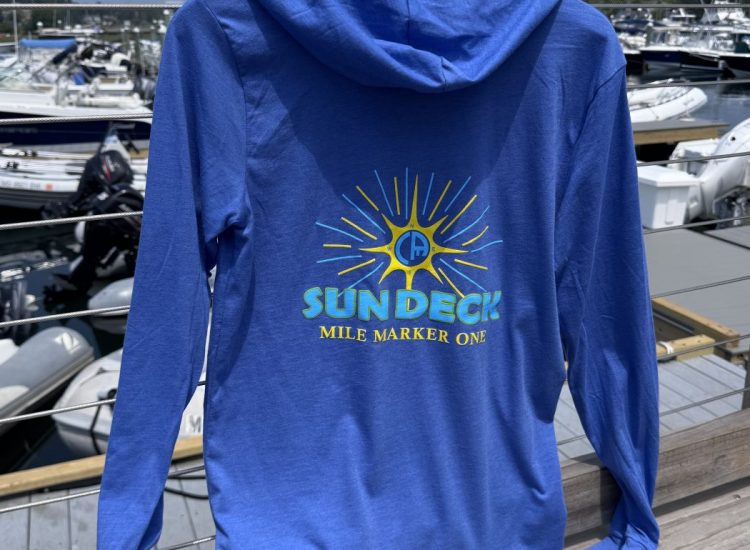 blue hooded long sleeve shirt, back says Sundeck