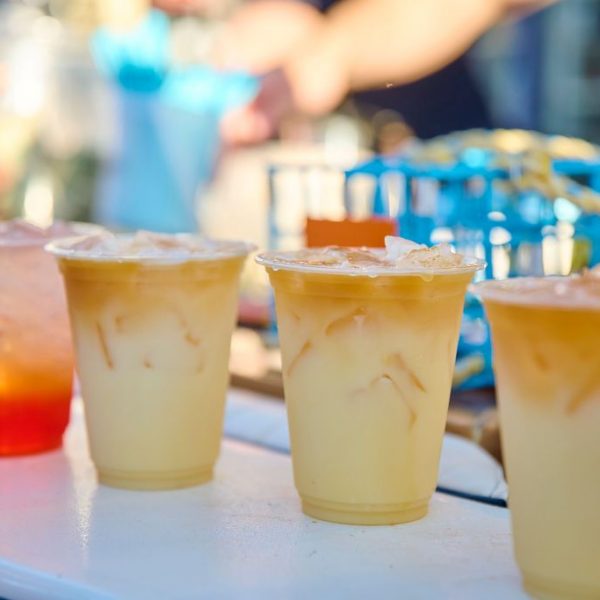 4 painkiller rum drinks on a counter